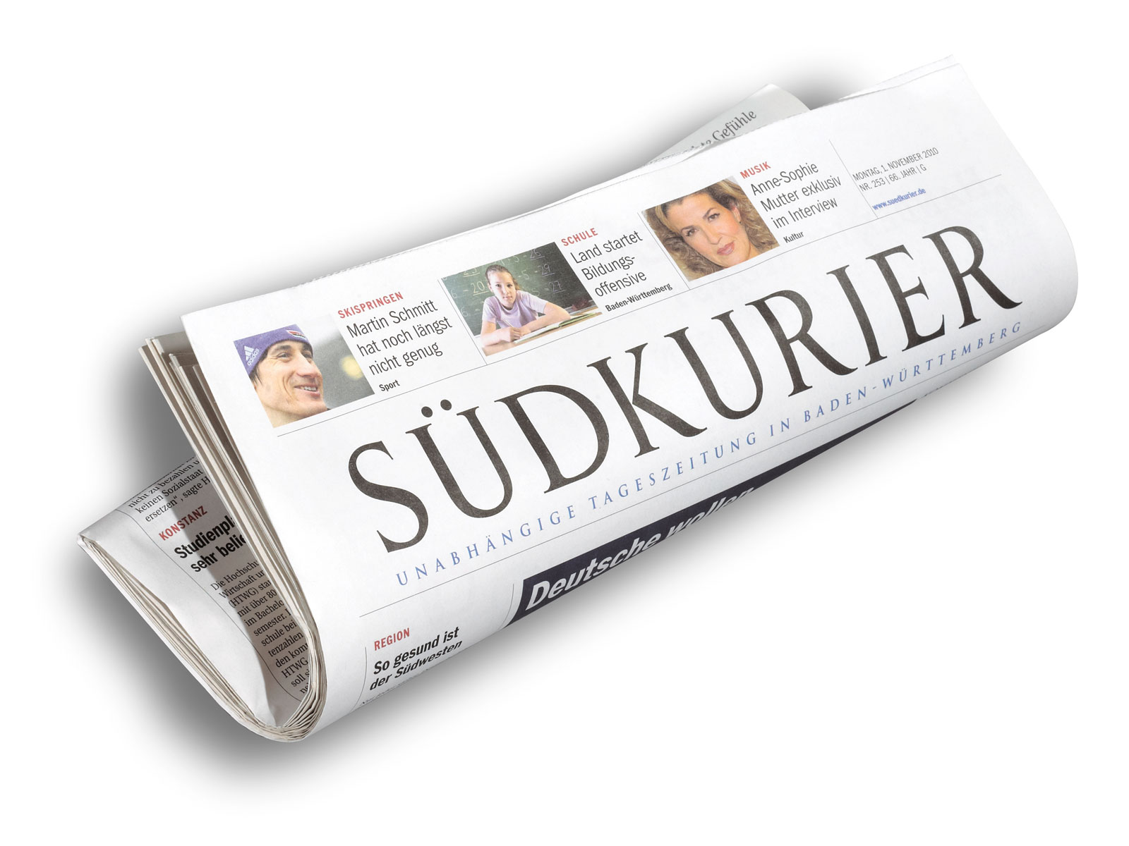 Eine gedruckte Tageszeitung mit dem Titel "SÜDKURIER", die Nachrichten aus Baden-Württemberg präsentiert.