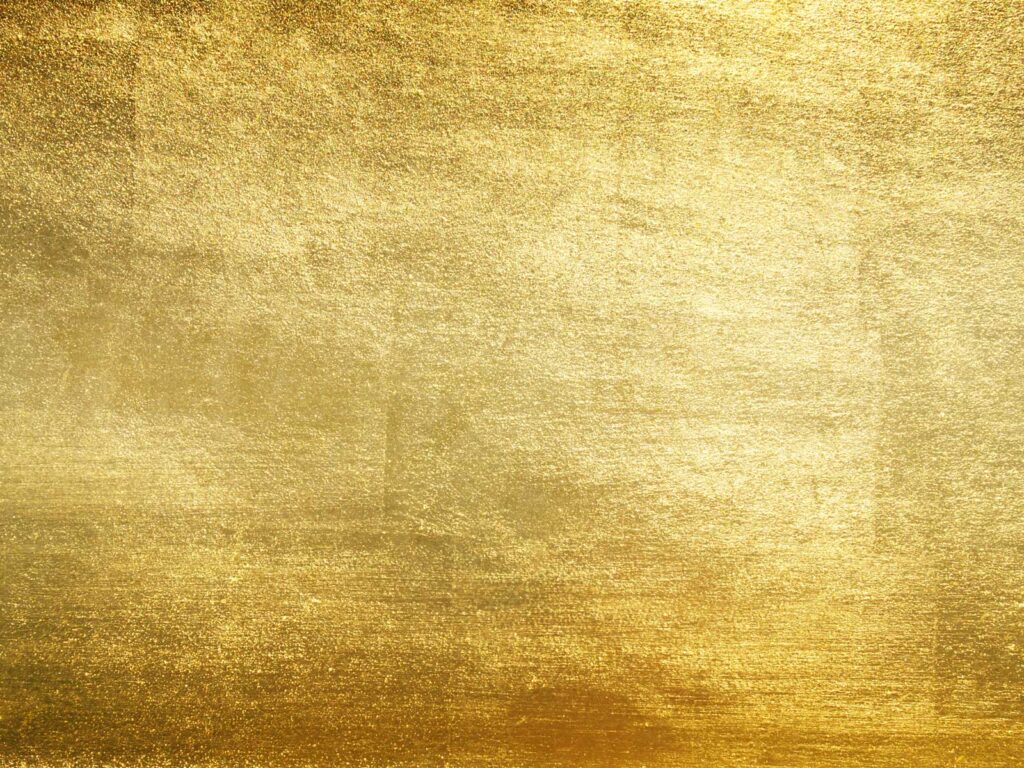 Ein glänzender goldener Hintergrund mit leicht strukturiertem Finish.