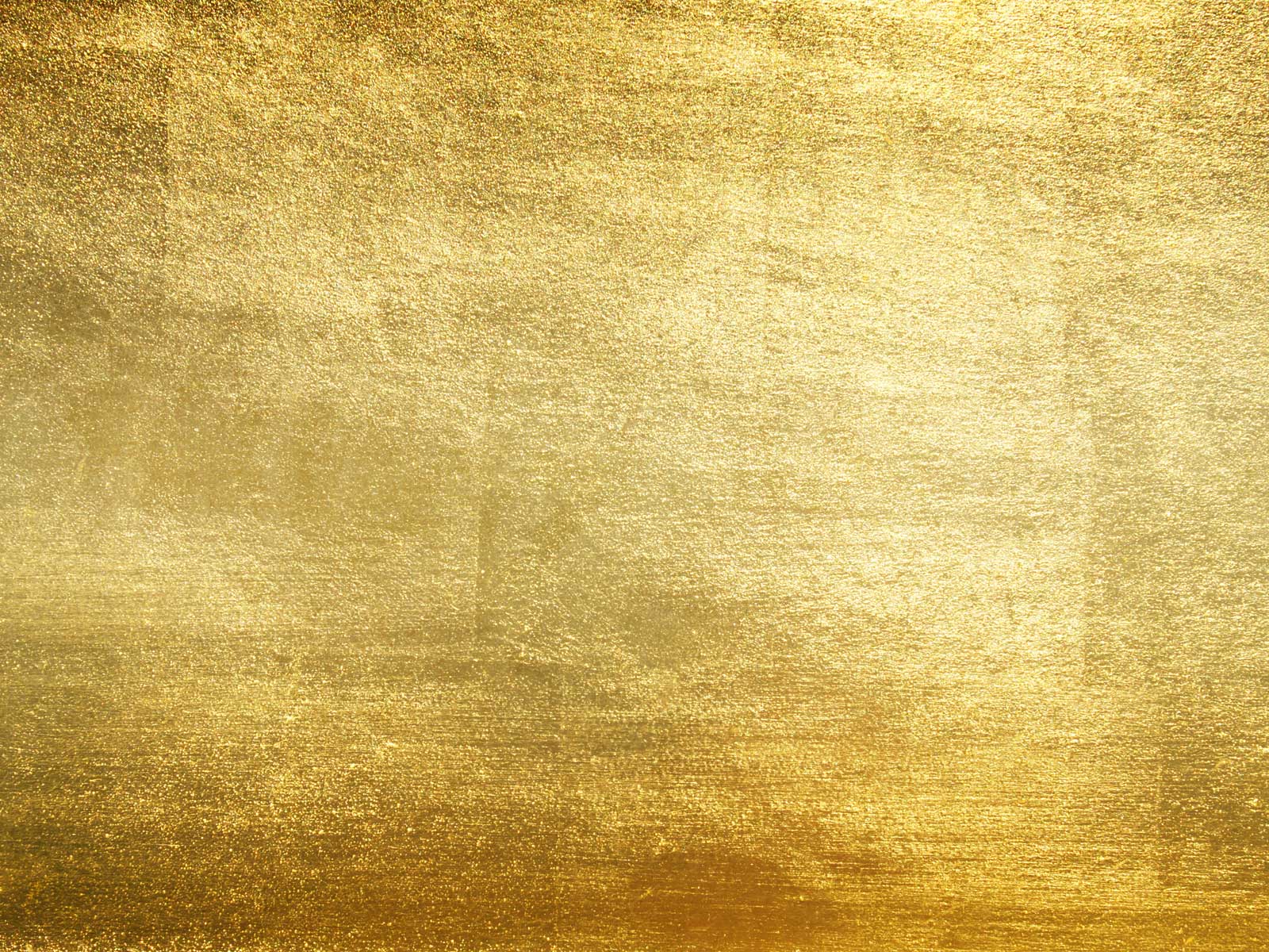 Ein glänzender goldener Hintergrund mit leicht strukturiertem Finish.