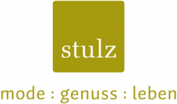 Logo von Stulz mit dem Slogan "mode : genuss : leben" in eleganter Schrift.
